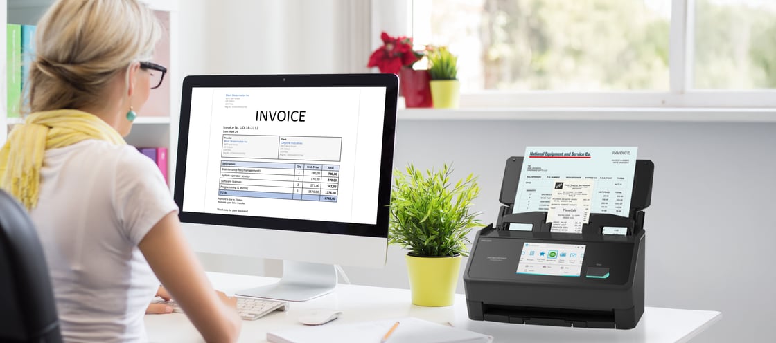 251202R0 iX2500RE Woman reviewing invoice